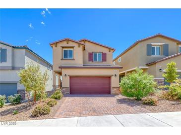 Charming two-story home with landscaped yard and brick driveway in a suburban neighborhood at 10979 Bristol Park Ave, Las Vegas, NV 89166