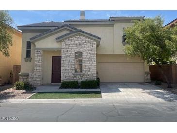 Inviting two-story home with stone accents, manicured landscaping, and a spacious two-car garage at 137 Coronation Ave, Las Vegas, NV 89123