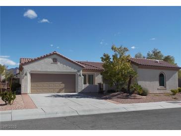 Charming single-story home featuring a tile roof and a two-car garage at 2138 Fort Halifax St, Henderson, NV 89052