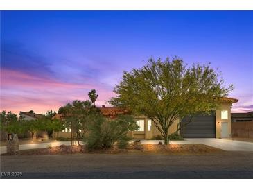 Charming single-story home featuring a well-manicured front yard and attached two-car garage at 4185 W Arby Ave, Las Vegas, NV 89118
