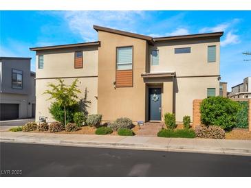 Modern two-story home with desert landscaping and a welcoming front entrance under a bright blue sky at 6141 May River St, Las Vegas, NV 89148