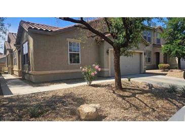 Charming single-Gathering home featuring a two-car garage, low-maintenance landscaping, and a cozy front yard at 6705 Frances Celia Ave, Las Vegas, NV 89122