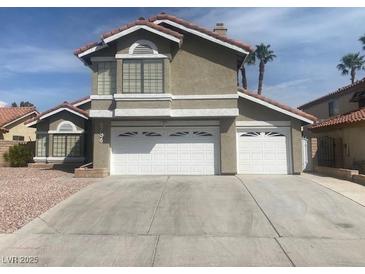 Charming two-story home with a two-car garage and well-maintained landscaping at 6736 Quinella Dr, Las Vegas, NV 89103