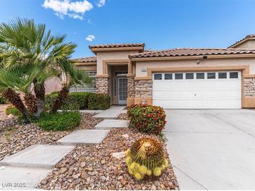 Charming single-story home with well-manicured landscaping and a two-car garage at 7892 Nookfield Dr, Las Vegas, NV 89147