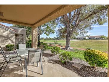 Charming covered patio with golf course views, perfect for outdoor relaxation and entertaining at 8901 Litchfield Ave, Las Vegas, NV 89134