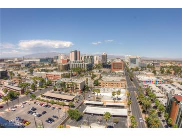 Expansive aerial view of the downtown area featuring a mix of buildings, streets, and scenic mountain views at 900 Las Vegas Blvd # 1113, Las Vegas, NV 89101