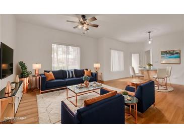 Bright living room with modern decor, plush rug, and stylish furnishings at 9303 Gilcrease Ave # 1245, Las Vegas, NV 89149