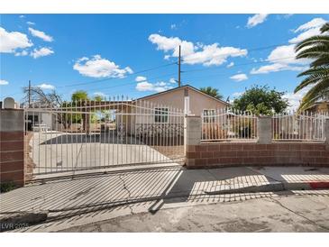 Charming home with secure gated entrance and covered carport at 2821 Geist Cir, Las Vegas, NV 89115