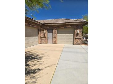 A spacious garage with stone veneer, providing ample parking and storage at 3910 Internet Ave, North Las Vegas, NV 89031