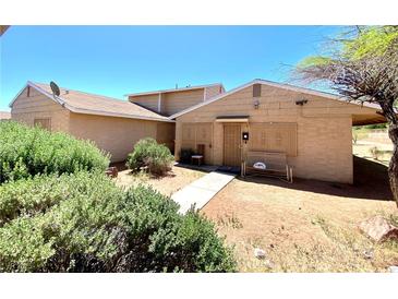 Charming single-story home with a secure front entry and desert-friendly landscaping at 5215 Gray Ln, Las Vegas, NV 89119