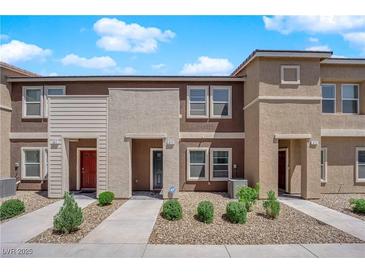Inviting two-story townhomes with well-maintained landscaping and charming curb appeal at 471 Secret Cove Ct, Henderson, NV 89002