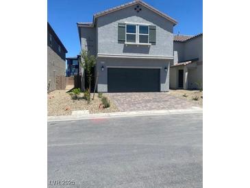 Charming two-story home with a paved driveway and well-maintained landscaping at 6574 Tumoulin St, Las Vegas, NV 89148