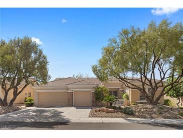 Charming single-story home featuring a three-car garage and a well-manicured desert landscaped front yard at 2864 Sumter Valley Cir, Henderson, NV 89052
