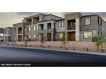 Contemporary townhome exterior featuring multiple stories, balconies, and modern architectural details at 321 Cymbal Pl # Lot 130, Henderson, NV 89015