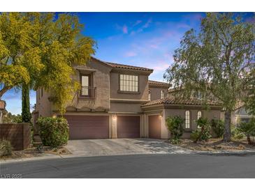 Charming two-story home featuring a three-car garage and beautifully landscaped front yard at 7872 Regency Park St, Las Vegas, NV 89149