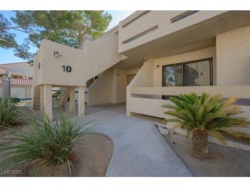 Condo building exterior featuring desert landscaping and stucco facade at 3791 Desert Marina Dr # 109, Laughlin, NV 89029