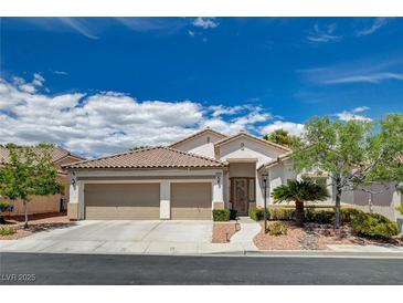 Charming single-story home showcasing a well-maintained yard, tile roof, and a spacious three-car garage at 4334 Libbiano Ct, Las Vegas, NV 89141