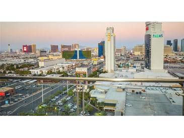 Breathtaking Las Vegas strip view featuring iconic landmarks, hotels, and casinos during a stunning sunset from balcony at 4381 W Flamingo Rd # 2302, Las Vegas, NV 89103