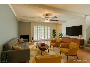 Bright living room features hardwood floors, fireplace, and lots of natural light at 516 Delfern Ln, Las Vegas, NV 89169