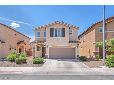 Charming two-story home featuring a two-car garage and a welcoming entrance at 6379 Dundock Ave, Las Vegas, NV 89122