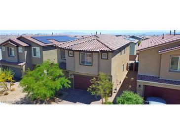 Beautiful two-story home featuring a tile roof, solar panels, and a spacious two-car garage at 8324 S Miller Ln, Las Vegas, NV 89113
