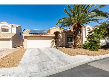 Charming single-story home featuring desert landscaping, solar panels, and a two-car garage at 2805 Rungsted St, Las Vegas, NV 89142