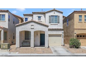 Charming two-story home with attached garage and covered front porch at 1316 Oak Village Ave, Las Vegas, NV 89183