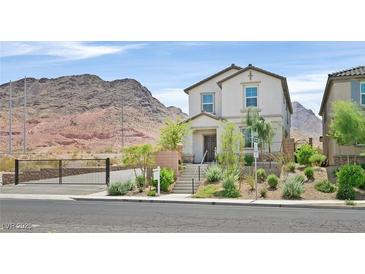 Charming home featuring a desert landscaped front yard, complemented by mountain views at 1388 Graphite Ave, Henderson, NV 89002