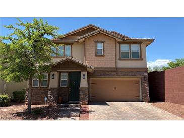 Charming two-story home with a two-car garage and landscaped front yard at 5627 Spanish Valor Rd, Las Vegas, NV 89135