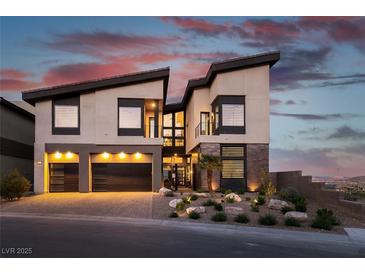 Modern two-story home with a two-car garage, and desert landscaping at 5436 Succulent Rose Dr, Las Vegas, NV 89135