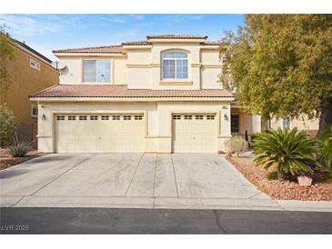 Charming two-story home featuring a three-car garage and desert landscaping at 5832 Ivy Vine Ct, Las Vegas, NV 89141