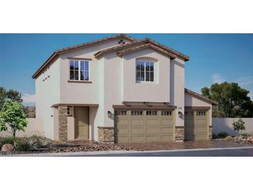 Charming two-story home with a three-car garage, stone accents, and a well-maintained front yard at 7754 Serenity Bay Ln # 140, North Las Vegas, NV 89084