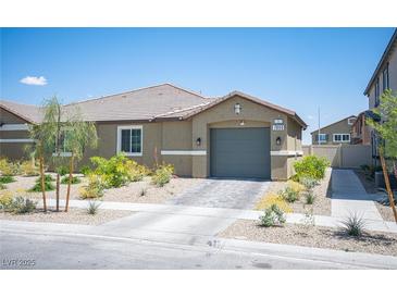Charming single-story home featuring desert landscaping and a two-car garage at 7890 Aurora Sky St # 1, North Las Vegas, NV 89084