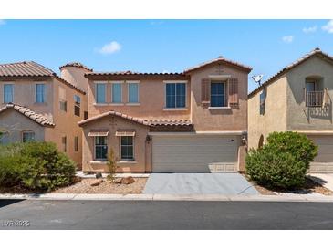 Inviting two-story home displaying a terracotta roof, two-car garage, and warm stucco exterior at 8059 Wards Ferry St, Las Vegas, NV 89139