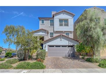 Charming two-story home with a two car garage, manicured landscaping, and inviting curb appeal at 96 Campbelltown Ave, Henderson, NV 89015