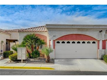 Charming single-story home featuring a two-car garage, well-manicured landscaping, and a desert-friendly yard at , Las Vegas, NV 89118
