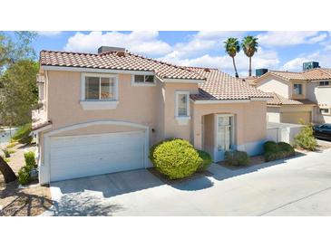 Charming two-story home with tile roof, attached garage, and well-maintained landscaping at 185 Renville Ct, Henderson, NV 89074