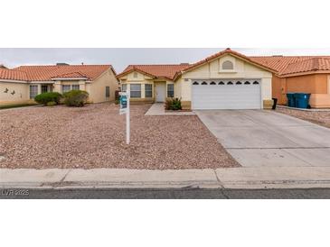 Charming single-story home with a well-maintained lawn, desert landscaping, and a two-car garage at 2595 Fort Lauderdale Dr, Las Vegas, NV 89156