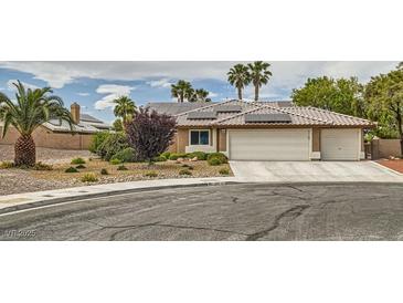 Charming single-story home with desert landscaping, three-car garage and solar panels at 3619 Bixbee Ct, Las Vegas, NV 89129