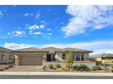 Charming single story home with a two car garage, desert landscaping, and a welcoming front entryway at 701 Monroe Hill Pl, Henderson, NV 89011