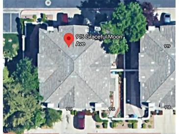 An aerial view shows the layout of attached homes, each with its own driveway and manicured landscaping at 915 Graceful Moon Ave, Henderson, NV 89015
