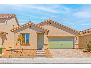 Charming single-story home featuring a well-manicured yard and a two-car garage at 3240 Lahontan St, North Las Vegas, NV 89032