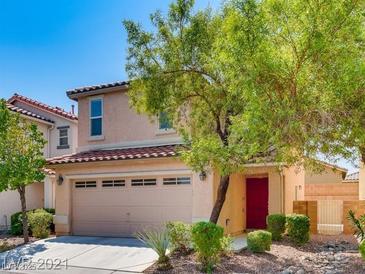 Charming two-story home featuring a two-car garage and a red front door at 3311 Fico Ave, Las Vegas, NV 89141