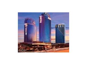 View of The Palms luxury resort with its modern architecture against a vibrant sunset at 4381 W Flamingo Rd # 27309, Las Vegas, NV 89103