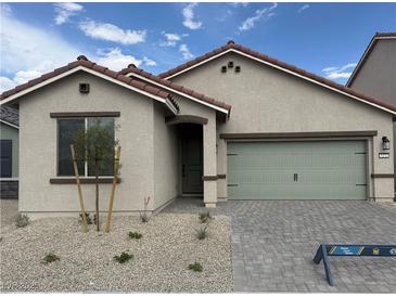 Charming single-story home features a well-manicured front yard and a neutral color palette at 4416 Cave Lake Ave, North Las Vegas, NV 89032