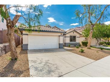 Charming single-story home featuring a two-car garage, desert landscaping, and a well-maintained front yard at 71 Blaven Dr, Henderson, NV 89002