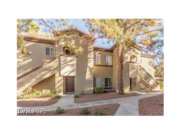 Charming condo building featuring a well-maintained exterior with desert landscaping and walkways at 9000 Las Vegas Blvd # 1016, Las Vegas, NV 89123