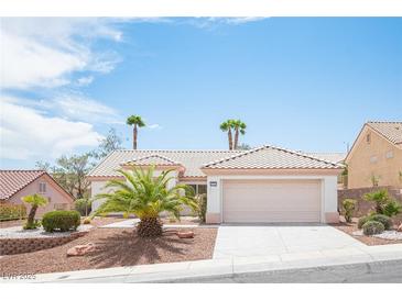 Charming single-story home featuring a well-maintained yard with desert landscaping and a two-car garage at 10321 Marymont Pl, Las Vegas, NV 89134