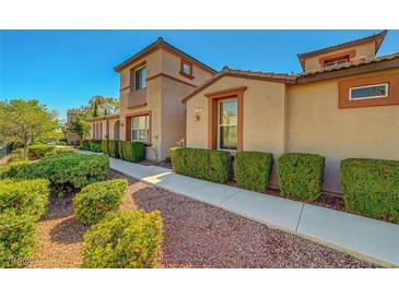 Well-maintained home featuring manicured landscaping and a charming walkway leading to the front entrance at 11356 Belmont Lake Dr # 103, Las Vegas, NV 89135
