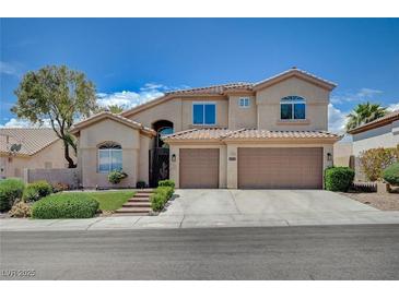 Charming two-story home with a three car garage and well maintained landscaping at 5405 Ireland St, Las Vegas, NV 89149